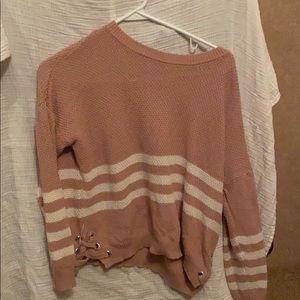 pink knitted sweater with three white stripes